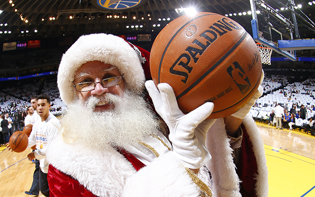 OAKLAND, CA - DECEMBER 25: Santa Claus takes a picture before the Los Angeles Clippers plays the Golden State Warriors on December 25, 2013 at Oracle Arena in Oakland, California. NOTE TO USER: User expressly acknowledges and agrees that, by downloading and or using this photograph, user is consenting to the terms and conditions of Getty Images License Agreement. Mandatory Copyright Notice: Copyright 2013 NBAE (Photo by Rocky Widner/NBAE via Getty Images)